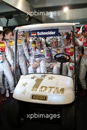 26.10.2008 Hockenheim, Germany,  On the occassion of the very last DTM race of Bernd Schneider, all the DTM drivers gathered in his pitbox. As as farewell present he received a customized golf card. - DTM 2008 at Hockenheimring, Germany