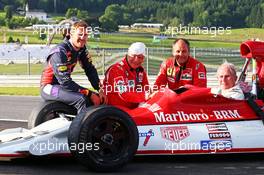 Dr Helmut Marko (AUT) Red Bull Motorsport Consultant, sitting in his old BRM P160, with (L to R): Sebastian Vettel (GER) Red Bull Racing; Niki Lauda (AUT) Mercedes Non-Executive Chairman; and Gerhard Berger (AUT). 21.06.2014. Formula 1 World Championship, Rd 8, Austrian Grand Prix, Spielberg, Austria, Qualifying Day.