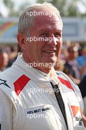 Dr Helmut Marko (AUT) Red Bull Motorsport Consultant in his old BRM overalls. 21.06.2014. Formula 1 World Championship, Rd 8, Austrian Grand Prix, Spielberg, Austria, Qualifying Day.