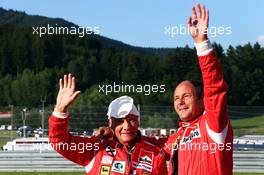 (L to R): Niki Lauda (AUT) Mercedes Non-Executive Chairman with Gerhard Berger (AUT). 21.06.2014. Formula 1 World Championship, Rd 8, Austrian Grand Prix, Spielberg, Austria, Qualifying Day.