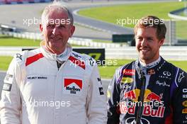 (L to R): Dr Helmut Marko (AUT) Red Bull Motorsport Consultant with Sebastian Vettel (GER) Red Bull Racing. 21.06.2014. Formula 1 World Championship, Rd 8, Austrian Grand Prix, Spielberg, Austria, Qualifying Day.