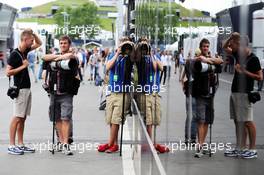 (L to R): Andy Hone (GBR) Photographer with Russell Batchelor (GBR) XPB Images Photographer. 19.06.2014. Formula 1 World Championship, Rd 8, Austrian Grand Prix, Spielberg, Austria, Preparation Day.