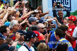 Kimi Raikkonen (FIN) Ferrari signs autographs for the fans. 19.06.2014. Formula 1 World Championship, Rd 8, Austrian Grand Prix, Spielberg, Austria, Preparation Day.
