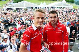 (L to R): Max Chilton (GBR) Marussia F1 Team and team mate Jules Bianchi (FRA) Marussia F1 Team. 19.06.2014. Formula 1 World Championship, Rd 8, Austrian Grand Prix, Spielberg, Austria, Preparation Day.