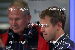 (L to R): Dr Helmut Marko (AUT) Red Bull Motorsport Consultant with Sebastian Vettel (GER) Red Bull Racing. 22.08.2014. Formula 1 World Championship, Rd 12, Belgian Grand Prix, Spa Francorchamps, Belgium, Practice Day.