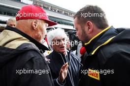 (L to R): Niki Lauda (AUT) Mercedes Non-Executive Chairman with Bernie Ecclestone (GBR) and Paul Hembery (GBR) Pirelli Motorsport Director on the grid. 24.08.2014. Formula 1 World Championship, Rd 12, Belgian Grand Prix, Spa Francorchamps, Belgium, Race Day.