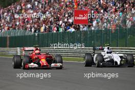 Kimi Raikkonen (FIN) Ferrari F14-T and Valtteri Bottas (FIN) Williams FW36 battle for position. 24.08.2014. Formula 1 World Championship, Rd 12, Belgian Grand Prix, Spa Francorchamps, Belgium, Race Day.