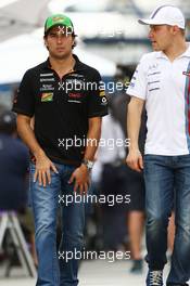 (L to R): Sergio Perez (MEX) Sahara Force India F1 with Valtteri Bottas (FIN) Williams. 07.11.2014. Formula 1 World Championship, Rd 18, Brazilian Grand Prix, Sao Paulo, Brazil, Practice Day.