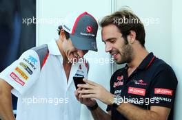 (L to R): Adrian Sutil (GER) Sauber with Jean-Eric Vergne (FRA) Scuderia Toro Rosso. 07.11.2014. Formula 1 World Championship, Rd 18, Brazilian Grand Prix, Sao Paulo, Brazil, Practice Day.