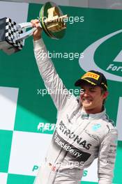Race winner Nico Rosberg (GER) Mercedes AMG F1 celebrates on the podium. 09.11.2014. Formula 1 World Championship, Rd 18, Brazilian Grand Prix, Sao Paulo, Brazil, Race Day.