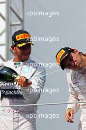 (L to R): Lewis Hamilton (GBR) Mercedes AMG F1 and Felipe Massa (BRA) Williams celebrate on the podium. 09.11.2014. Formula 1 World Championship, Rd 18, Brazilian Grand Prix, Sao Paulo, Brazil, Race Day.