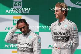 The podium (L to R): second placed Lewis Hamilton (GBR) Mercedes AMG F1 with race winner and team mate Nico Rosberg (GER) Mercedes AMG F1. 09.11.2014. Formula 1 World Championship, Rd 18, Brazilian Grand Prix, Sao Paulo, Brazil, Race Day.