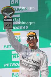Lewis Hamilton (GBR) Mercedes AMG F1 celebrates his second position on the podium. 09.11.2014. Formula 1 World Championship, Rd 18, Brazilian Grand Prix, Sao Paulo, Brazil, Race Day.