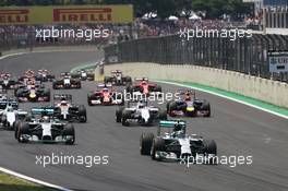 Nico Rosberg (GER) Mercedes AMG F1 W05 leads at the start of the race. 09.11.2014. Formula 1 World Championship, Rd 18, Brazilian Grand Prix, Sao Paulo, Brazil, Race Day.
