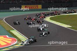 Nico Rosberg (GER) Mercedes AMG F1 W05 leads at the start of the race. 09.11.2014. Formula 1 World Championship, Rd 18, Brazilian Grand Prix, Sao Paulo, Brazil, Race Day.