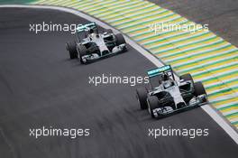 Nico Rosberg (GER) Mercedes AMG F1 W05 leads team mate Lewis Hamilton (GBR) Mercedes AMG F1 W05. 09.11.2014. Formula 1 World Championship, Rd 18, Brazilian Grand Prix, Sao Paulo, Brazil, Race Day.