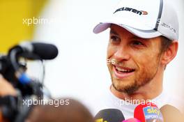 Jenson Button (GBR) McLaren with the media. 08.11.2014. Formula 1 World Championship, Rd 18, Brazilian Grand Prix, Sao Paulo, Brazil, Qualifying Day.