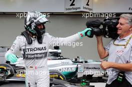 Nico Rosberg (GER) Mercedes AMG F1 celebrates his pole position in parc ferme. 08.11.2014. Formula 1 World Championship, Rd 18, Brazilian Grand Prix, Sao Paulo, Brazil, Qualifying Day.
