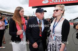 John Surtees (GBR) with his daughters on the grid. 06.07.2014. Formula 1 World Championship, Rd 9, British Grand Prix, Silverstone, England, Race Day.