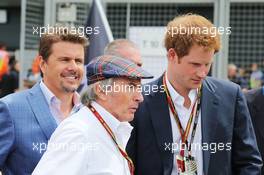 (L to R): Mark Stewart (GBR) with Jackie Stewart (GBR) and HRH Prince Harry (GBR) on the grid. 06.07.2014. Formula 1 World Championship, Rd 9, British Grand Prix, Silverstone, England, Race Day.