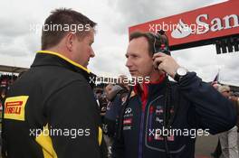 (L to R): Paul Hembery (GBR) Pirelli Motorsport Director with Christian Horner (GBR) Red Bull Racing Team Principal on the grid. 06.07.2014. Formula 1 World Championship, Rd 9, British Grand Prix, Silverstone, England, Race Day.