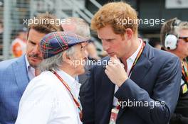 (L to R): Jackie Stewart (GBR) on the grid with HRH Prince Harry (GBR). 06.07.2014. Formula 1 World Championship, Rd 9, British Grand Prix, Silverstone, England, Race Day.