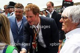 HRH Prince Harry (GBR) on the grid with Bernie Ecclestone (GBR). 06.07.2014. Formula 1 World Championship, Rd 9, British Grand Prix, Silverstone, England, Race Day.