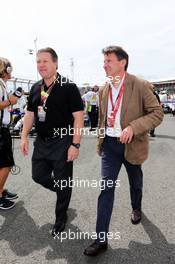 (L to R): Zak Brown (USA) Just Marketing CEO with Lord Sebastian Coe (GBR) on the grid. 06.07.2014. Formula 1 World Championship, Rd 9, British Grand Prix, Silverstone, England, Race Day.