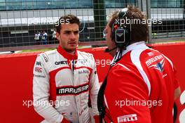 Jules Bianchi (FRA) Marussia F1 Team on the grid with Dave Greenwood (GBR) Marussia F1 Team Race Engineer. 06.07.2014. Formula 1 World Championship, Rd 9, British Grand Prix, Silverstone, England, Race Day.