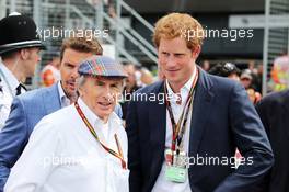 (L to R): Jackie Stewart (GBR) on the grid with HRH Prince Harry (GBR). 06.07.2014. Formula 1 World Championship, Rd 9, British Grand Prix, Silverstone, England, Race Day.