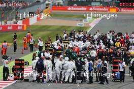 Race retiree Felipe Massa (BRA) Williams FW36 at the back of the grid as the race is stopped. 06.07.2014. Formula 1 World Championship, Rd 9, British Grand Prix, Silverstone, England, Race Day.