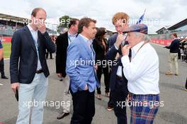 (L to R): Mark Stewart; HRH Prince Harry (GBR) and Jackie Stewart (GBR) on the grid. 06.07.2014. Formula 1 World Championship, Rd 9, British Grand Prix, Silverstone, England, Race Day.