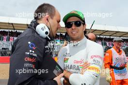 Sergio Perez (MEX) Sahara Force India F1 with Gianpiero Lambiase (ITA) Sahara Force India F1 Engineer on the grid. 06.07.2014. Formula 1 World Championship, Rd 9, British Grand Prix, Silverstone, England, Race Day.