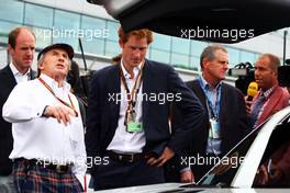 (L to R): Jackie Stewart (GBR) with HRH Prince Harry (GBR) on the grid. 06.07.2014. Formula 1 World Championship, Rd 9, British Grand Prix, Silverstone, England, Race Day.