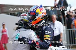 Race winner Lewis Hamilton (GBR) Mercedes AMG F1 celebrates in parc ferme with third placed Daniel Ricciardo (AUS) Red Bull Racing. 06.07.2014. Formula 1 World Championship, Rd 9, British Grand Prix, Silverstone, England, Race Day.