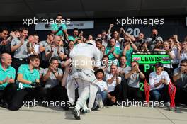 Race winner Lewis Hamilton (GBR) Mercedes AMG F1 celebrates with the team. 06.07.2014. Formula 1 World Championship, Rd 9, British Grand Prix, Silverstone, England, Race Day.