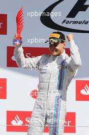 Valtteri Bottas (FIN) Williams celebrates his second position on the podium. 06.07.2014. Formula 1 World Championship, Rd 9, British Grand Prix, Silverstone, England, Race Day.