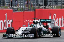 Race winner Lewis Hamilton (GBR) Mercedes AMG F1 W05 celebrates at the end of the race. 06.07.2014. Formula 1 World Championship, Rd 9, British Grand Prix, Silverstone, England, Race Day.