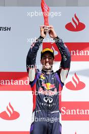 Daniel Ricciardo (AUS) Red Bull Racing celebrates his third position on the podium. 06.07.2014. Formula 1 World Championship, Rd 9, British Grand Prix, Silverstone, England, Race Day.