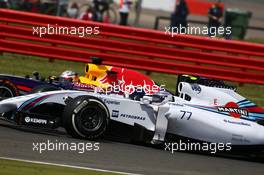 Valtteri Bottas (FIN) Williams FW36 and Sebastian Vettel (GER) Red Bull Racing RB10 battle for position. 06.07.2014. Formula 1 World Championship, Rd 9, British Grand Prix, Silverstone, England, Race Day.