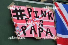 A Pink For Papa banner in tribute to the late John Button (GBR). 06.07.2014. Formula 1 World Championship, Rd 9, British Grand Prix, Silverstone, England, Race Day.