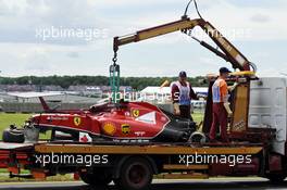The Ferrari F14-T of Kimi Raikkonen (FIN) Ferrari is recovered back to the pits on the back of a truck after he crashed heavily at the start of the race. 06.07.2014. Formula 1 World Championship, Rd 9, British Grand Prix, Silverstone, England, Race Day.