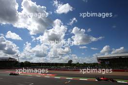 Fernando Alonso (ESP), Scuderia Ferrari and Sebastian Vettel (GER), Red Bull Racing  06.07.2014. Formula 1 World Championship, Rd 9, British Grand Prix, Silverstone, England, Race Day.