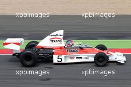Emerson Fittipaldi (BRA) drives the McLaren M23 06.07.2014. Formula 1 World Championship, Rd 9, British Grand Prix, Silverstone, England, Race Day.