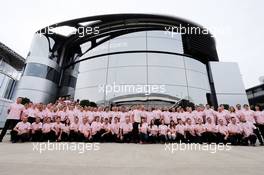 The McLaren team and Button family wear Pink for Papa, in tribute to the late John Button (GBR). 06.07.2014. Formula 1 World Championship, Rd 9, British Grand Prix, Silverstone, England, Race Day.