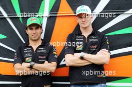 (L to R): Sergio Perez (MEX) Sahara Force India F1 and team mate Nico Hulkenberg (GER) Sahara Force India F1 with the team caravan. 03.07.2014. Formula 1 World Championship, Rd 9, British Grand Prix, Silverstone, England, Preparation Day.