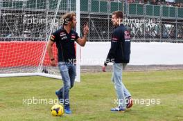 Jean-Eric Vergne (FRA) Scuderia Toro Rosso and Daniil Kvyat (RUS) Scuderia Toro Rosso take penalty kicks. 03.07.2014. Formula 1 World Championship, Rd 9, British Grand Prix, Silverstone, England, Preparation Day.