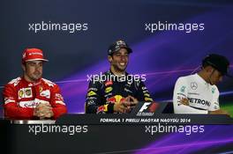 The post race FIA Press Conference (L to R): Fernando Alonso (ESP) Ferrari, second; Daniel Ricciardo (AUS) Red Bull Racing, race winner; Lewis Hamilton (GBR) Mercedes AMG F1, third. 27.07.2014. Formula 1 World Championship, Rd 11, Hungarian Grand Prix, Budapest, Hungary, Race Day.