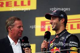 Race winner Daniel Ricciardo (AUS) Red Bull Racing on the podium with Martin Brundle (GBR) Sky Sports Commentator. 27.07.2014. Formula 1 World Championship, Rd 11, Hungarian Grand Prix, Budapest, Hungary, Race Day.