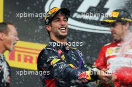 Race winner Daniel Ricciardo (AUS) Red Bull Racing celebrates with the champagne on the podium. 27.07.2014. Formula 1 World Championship, Rd 11, Hungarian Grand Prix, Budapest, Hungary, Race Day.